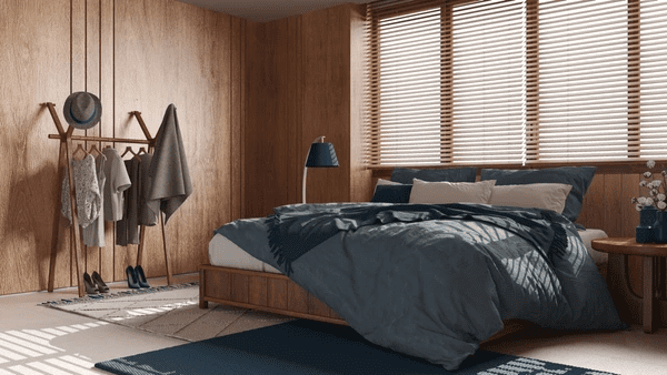 A cozy bedroom with modern Venetian blinds, adding elegance and style to the space.