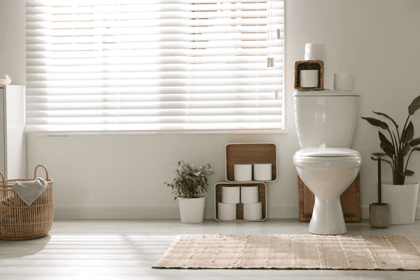 A bright and elegant bathroom featuring modern white window blinds, enhancing privacy and style. The best blinds in Dubai 2025 for a sleek, affordable, and functional design.