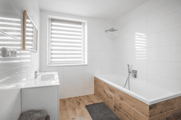 A sleek and modern bathroom featuring elegant white window blinds, enhancing privacy and style. The best blinds in Dubai 2025 for a contemporary and affordable look.