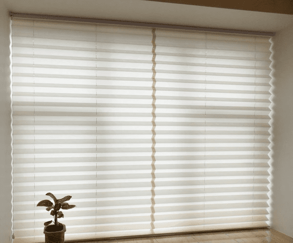 Elegant beige pleated blinds covering a large window, enhancing natural light while providing privacy in an eco-friendly and recyclable design.