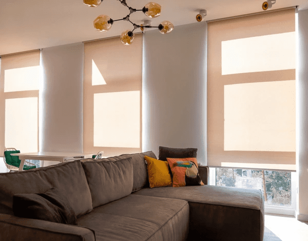 Modern motorized roller blinds in a stylish Dubai apartment, offering a trendy and functional window treatment for 2025. These smart blinds provide privacy, energy efficiency, and contemporary appeal.