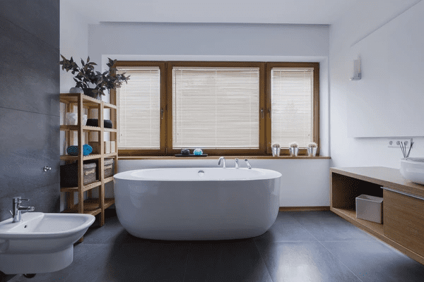 Modern bathroom with wooden Venetian blinds on large windows, offering privacy and a stylish natural touch for Dubai homes.