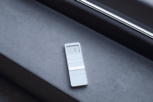 A sleek remote control for roman blind 2025 best and cheap in Dubai, placed on a modern windowsill, showcasing smart automation for effortless blind operation.