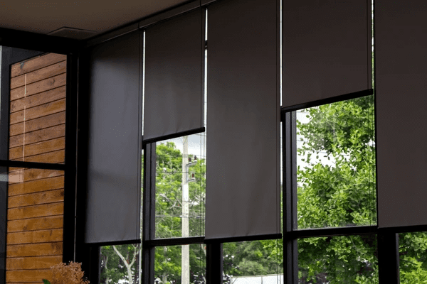 Best Long Blinds in Dubai 2025 - Sleek black roller blinds covering large windows, blending luxury with modern design.