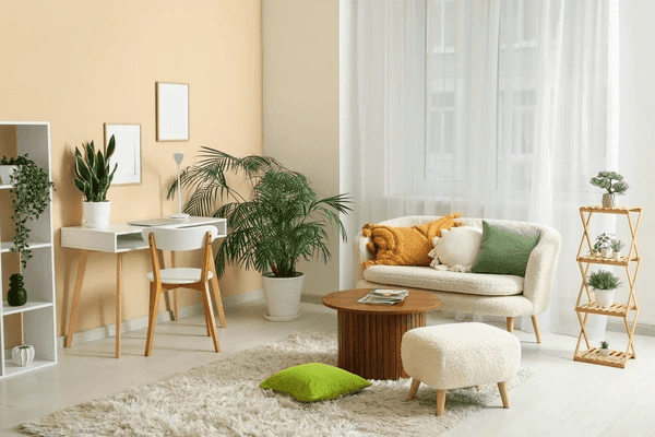 Bright and elegant living room in Dubai featuring sleek anti-condensation blinds behind soft sheer curtains.