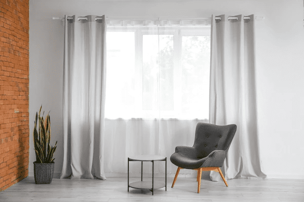 Minimalist living room with heat-insulation curtains, blending sleek design with superior functionality.
