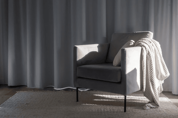 Modern living room with heat-insulation curtains, creating a sleek and cozy atmosphere.