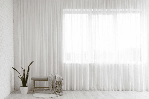 Minimalist living space with heat-insulation curtains that offer both style and superior insulation.