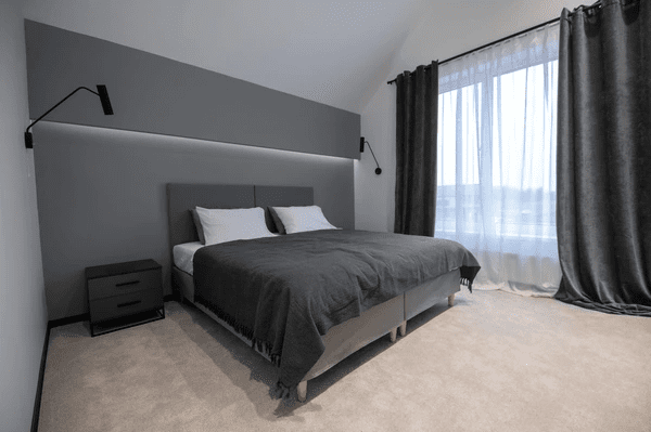 Modern bedroom with heat-insulation smart curtains, blending sleek design with advanced functionality.