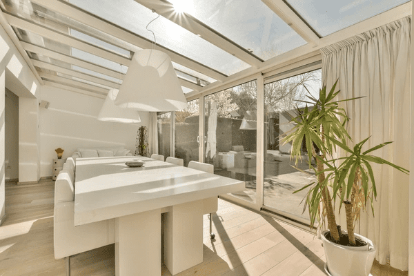 Contemporary dining area with heat-insulation curtains, blending style and functionality.