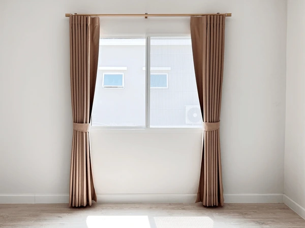 Minimalist brown pleated curtains from Emirati Blinds & Curtains Dubai 2025 collection, styled for sleek modern interiors.