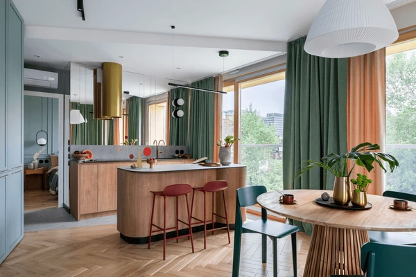 Best Green Wall Curtains in Dubai 2025 featuring modern green wall curtains in a stylish dining and kitchen interior with wooden furniture, sleek design, and natural light.