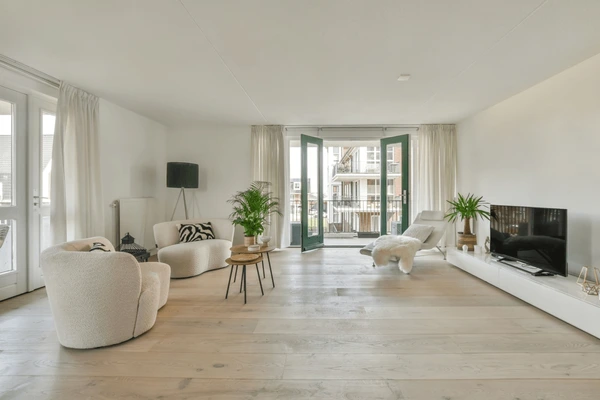 Spacious modern living room with airy white normal sized short curtains in Dubai 2025, indoor plants, and stylish minimal furniture.