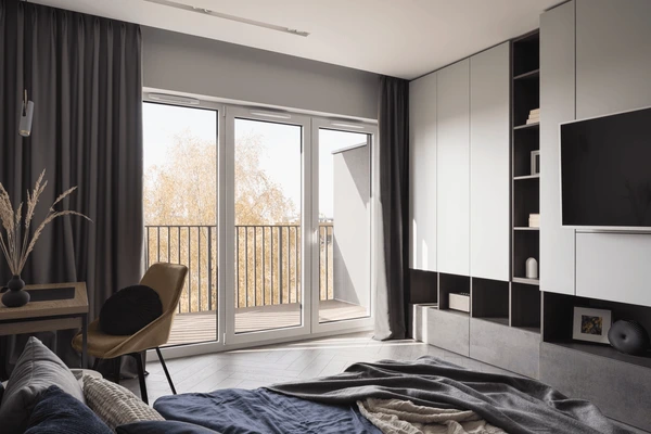 A modern bedroom with dark Best Blackout Curtains covering large balcony windows creating a sleek elegant and cozy interior for Christmas in Dubai 2025.